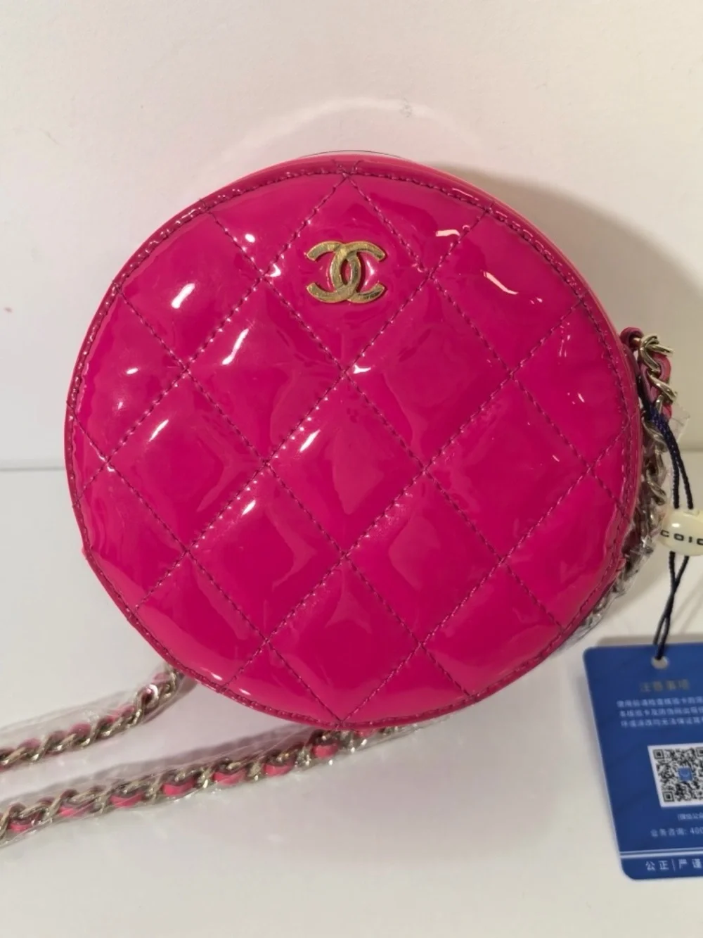 CHANEL Hot Pink Quilted Patent Leather Round Crossbody with Gold CC